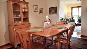 a dining room with a wooden table and chairs at The Sunset Hideaway in Cape May