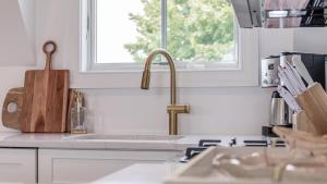 a kitchen counter with a sink and a window at The Ocean Loft At Kings in Cape May +30 photos