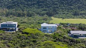 an aerial view of a house on a hill at Fijnduin Beach House in Keurboomstrand