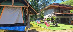 a tent in the yard of a house at Yao Noi Hostel by KR in Ko Yao Noi