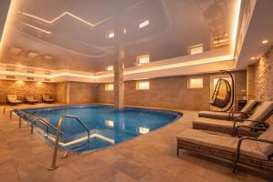 a large swimming pool in a hotel room at Lázeňský hotel Pyramida in Františkovy Lázně