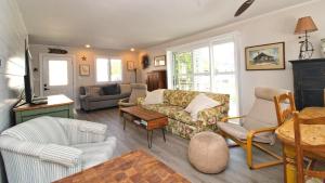 a living room with a couch and chairs at Dunescape in West Cape May