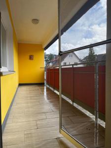 an empty room with a view of a balcony at Ferienwohnung Fatlume 2 in Bad Honnef am Rhein