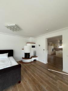 a bedroom with a bed and a fireplace in it at Ferienwohnung Fatlume 2 in Bad Honnef am Rhein