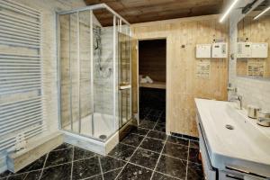 a bathroom with a shower and a sink at Chalet Dacha in Zell am See +34 photos