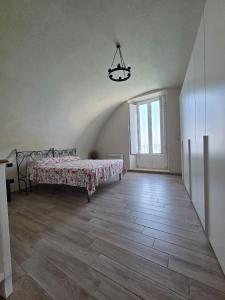 a large room with a bed and a large window at Seaside Soul in Tropea