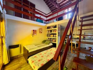a room with a bed and a book shelf at Loft Helena - acogedor, completo y céntrico in Jesús María