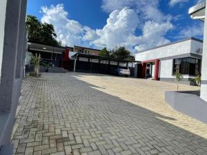 a brick driveway in front of a building at Premium View Guesthouse in Windhoek