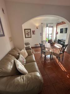 a living room with a couch and a table at Tijarafe 2 in Tijarafe