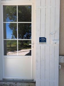 a door with a sign in front of it at Domaine et Manoir du Picaud in Monestier