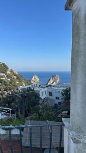 a view of the ocean from the balcony of a building at Villa Lyla in Capri