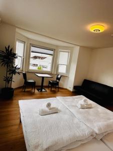 a bedroom with a bed with two towels on it at Ferienwohnung Trinh in Überlingen