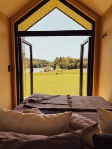 Ένα ή περισσότερα κρεβάτια σε δωμάτιο στο Tiny House Glamping Mak