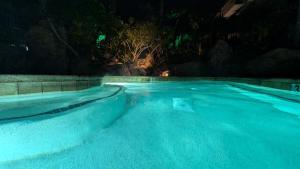 a swimming pool at night at Oceanside Cozy Fun and Resortsy Getaway in Oceanside