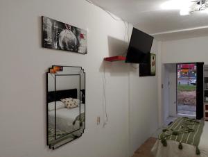 a bedroom with a mirror on the wall and a bed at Rinconcito Veracruzano in Veracruz