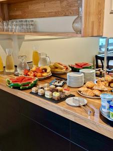 a buffet with various types of food on a table at Hotel Maj Inn in Moravske-Toplice