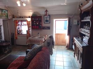 a room with a bed and a sink in it at Historic old Cottage Co Mayo in Ballinrobe