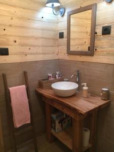 a bathroom with a sink and a mirror at Il Borgo Don Camillo in Pian di Novello