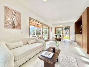 a living room with a couch and a table at Perla di Mergozzo 2 in Mergozzo