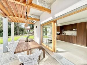 a dining room with a wooden table and chairs at Perla di Mergozzo 2 in Mergozzo +31 photos