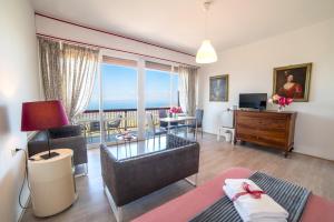 a living room with a view of the ocean at Belvedere del Lago in Montefiascone