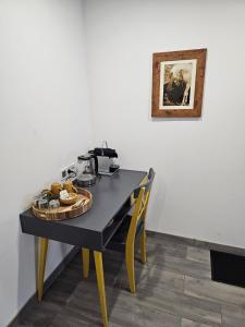 a black table with a plate of food on it at La petite ferme 37 in Épeigné-les-Bois +10 photos