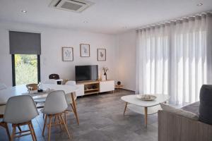 a living room with a couch and a table at The Douro Nest in Valença do Douro