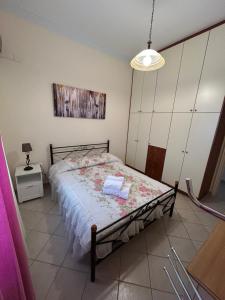 a bedroom with a bed in a room at Casa Kelly Chios in Chios