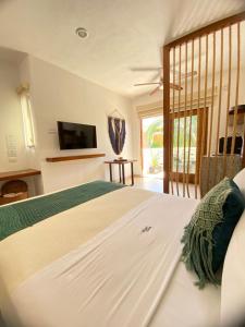 Voodi või voodid majutusasutuse Latino Hotel Boutique toas +63 fotot