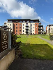 a large brick building with a sign in front of it at Superb 3-Bed Residence Airport in Dublin