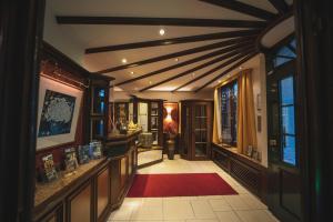 a hallway of a home with a red rug at Landhotel Goldener Acker in Morsbach