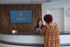 a woman standing in front of a barber shop at Heritage Cairns Hotel in Cairns +54 photos