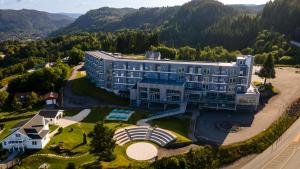 an aerial view of a large building in the mountains at Utsikten Hotell Kvinesdal - Unike Hoteller in Kvinesdal