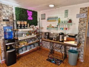 a room with a kitchen with a counter with food at Shalom_MatSofy in Santiago
