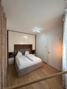 a bedroom with a large bed with a large mirror at Villa Hajdi Q & U in Merano +54 photos