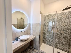 a bathroom with a sink and a shower at La Giara in Vulcano