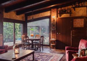 a dining room with a table and chairs in a room at Small Paradise Palermo in Palermo