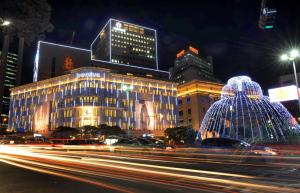 a city at night with a building and a street at B My Guesthouse in Seoul
