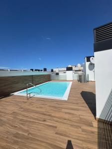 a swimming pool on the roof of a house at Seba Deluxe Home in Puerto de Santiago