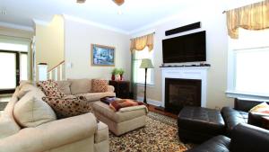 a living room with a couch and a fireplace at 320 Knox Avenue, Cape May Point in Cape May Point