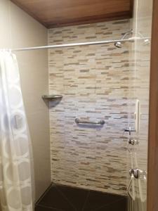 a bathroom with a shower with a glass door at Villa Amaranto Oxapampa in Oxapampa +73 photos