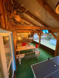 a room with a ping pong table in a house at Igły i szyszki in Zimna Woda +27 photos