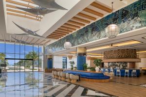 a lobby of a resort with a bar at Ocean Eden Bay - Adults Only - All Inclusive in Falmouth +77 photos
