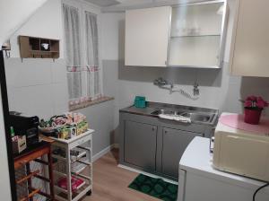 a small kitchen with a sink and a counter at Arkem's home in Norma +38 photos
