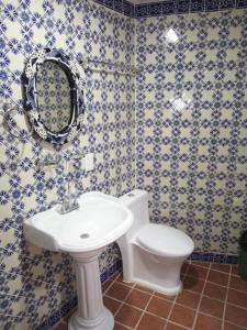 a bathroom with a toilet and a sink at hotel rio mar in Puerto Vallarta