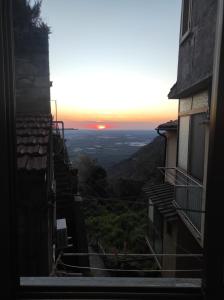 a view of the sunset from an alley way at Arkem's home in Norma