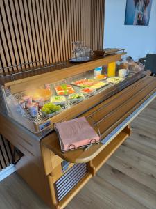 a buffet line with food in a restaurant at Pension Genz in Bad Karlshafen