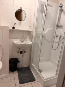 a bathroom with a shower and a sink at daroomz in Gloggnitz