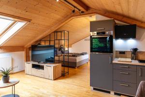 a kitchen with a large refrigerator in a room at Landhausvilla Watzmannblick in Saaldorf-Surheim