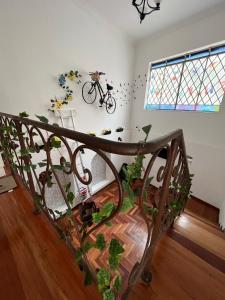 a room with a staircase with a bike on the wall at Av Paulista GF in São Paulo +4 photos
